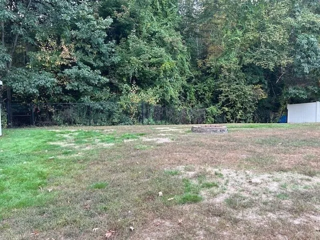 a view of outdoor space with deck and yard