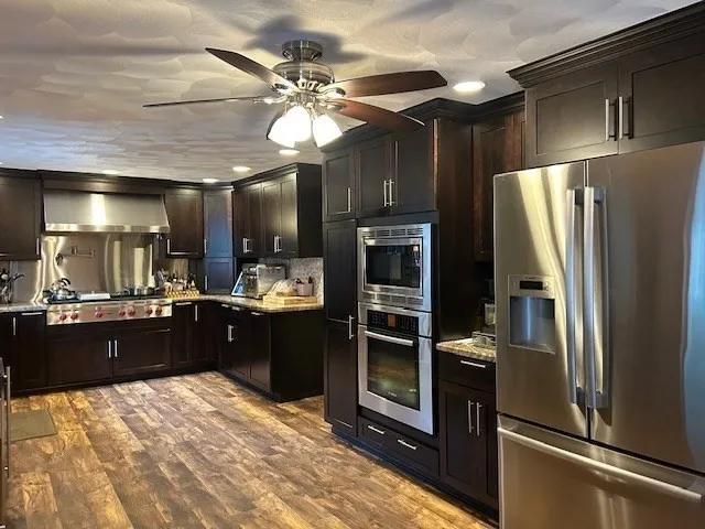 a kitchen with a refrigerator and countertop