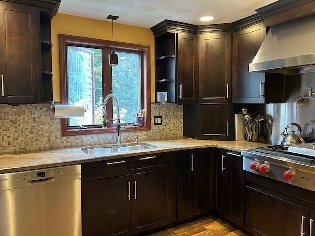 14 A Reed Street Londonderry, NH 03053 - Photo 7 of 39 a kitchen with granite countertop a sink stainless steel appliances wooden floor and a counter top space