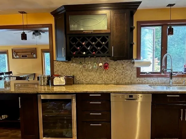 a kitchen with a sink and cabinets