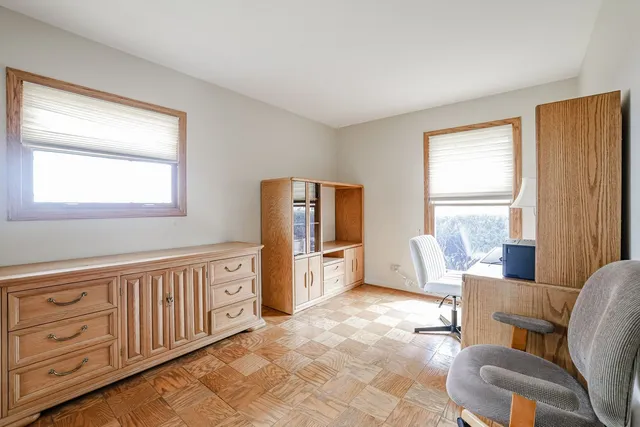 a large white room with furniture and windows