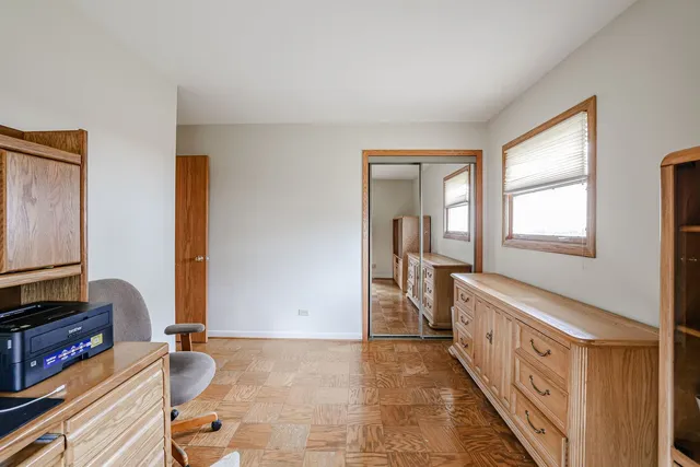 a hallway with a large window and couch