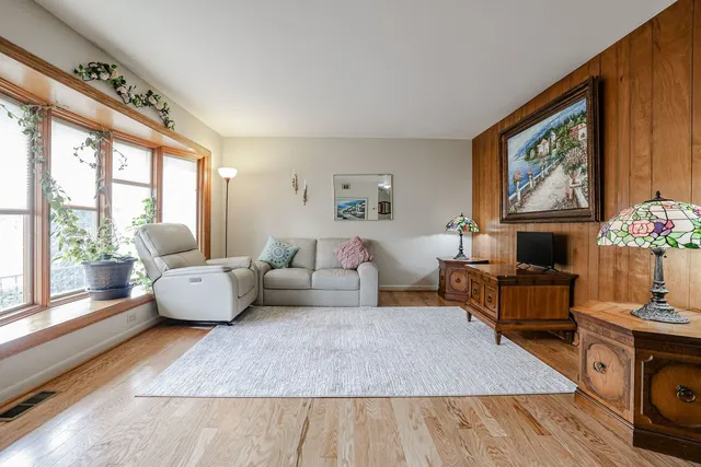 a living room with furniture fireplace and flat screen tv