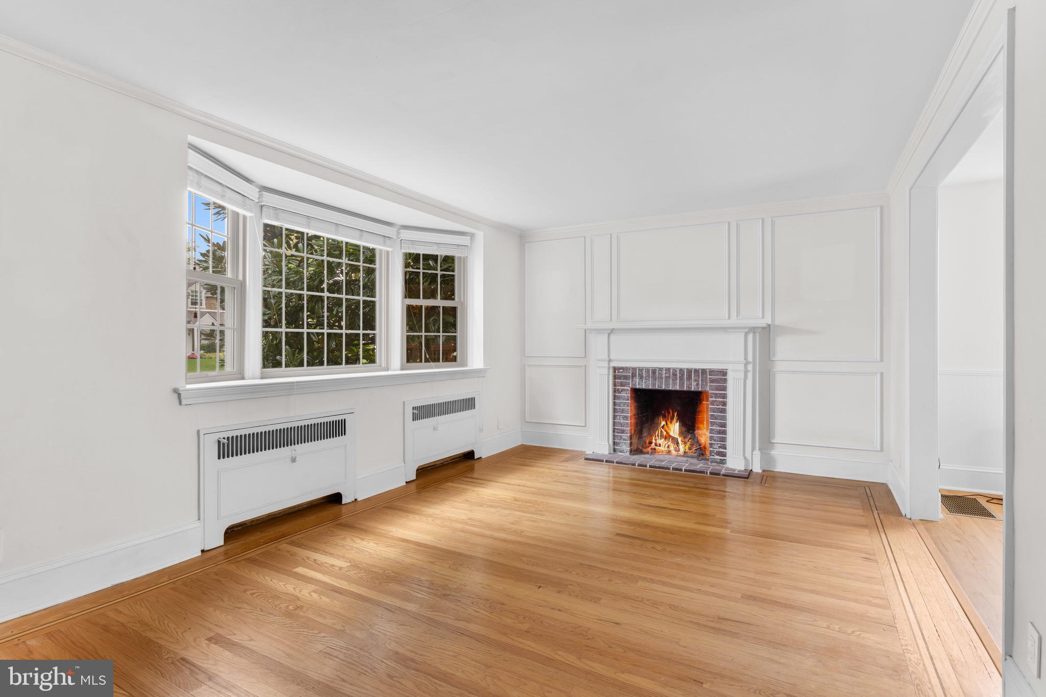 56 West Chelfield Road Glenside, PA 19038 - Photo 4 of 39 Living Room w/ bay window & wood burning fireplace