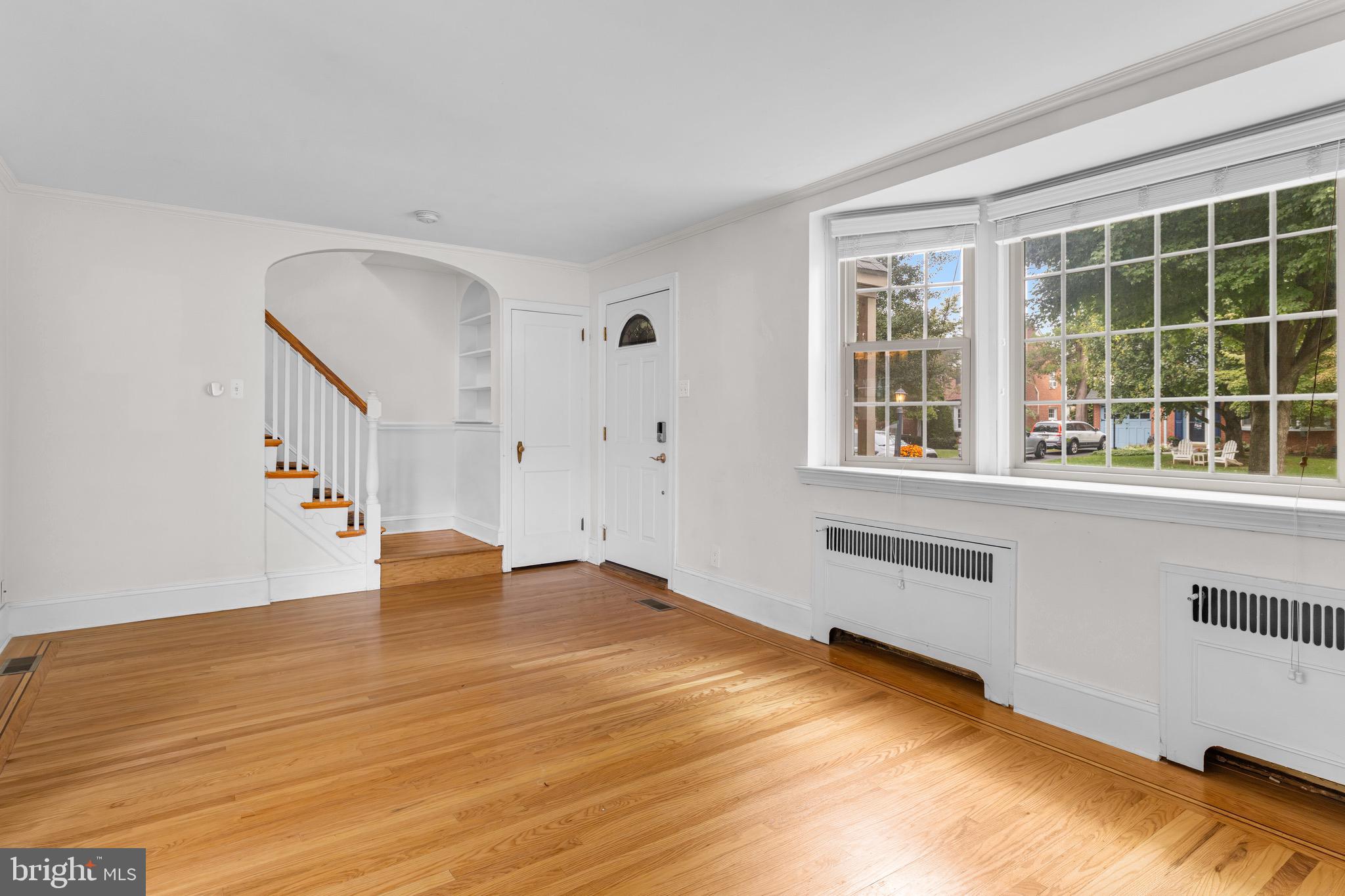 56 West Chelfield Road Glenside, PA 19038 - Photo 5 of 39 Living Room w/ bay window & wood burning fireplace