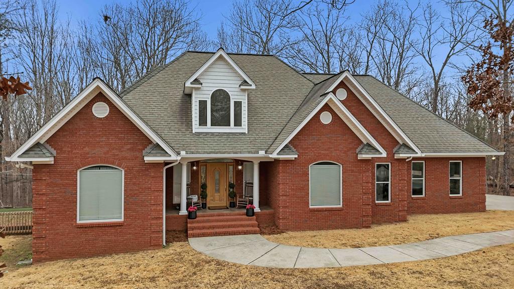 174 White Tail Ridge Road Jasper, GA 30143 - Photo 1 of 66 a front view of a house with garden