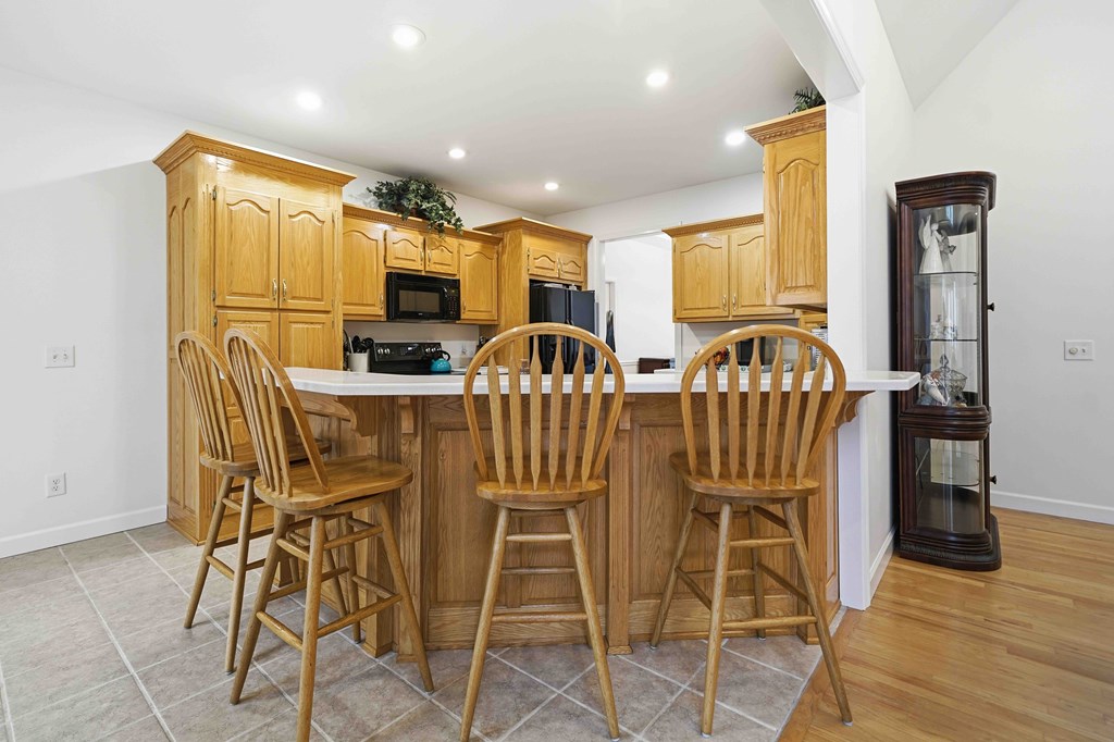 174 White Tail Ridge Road Jasper, GA 30143 - Photo 11 of 66 a view of a dining room with furniture and wooden floor