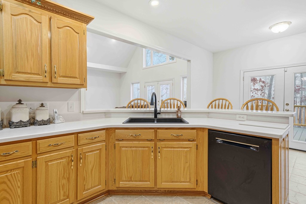 174 White Tail Ridge Road Jasper, GA 30143 - Photo 15 of 66 a kitchen with white cabinets and sink