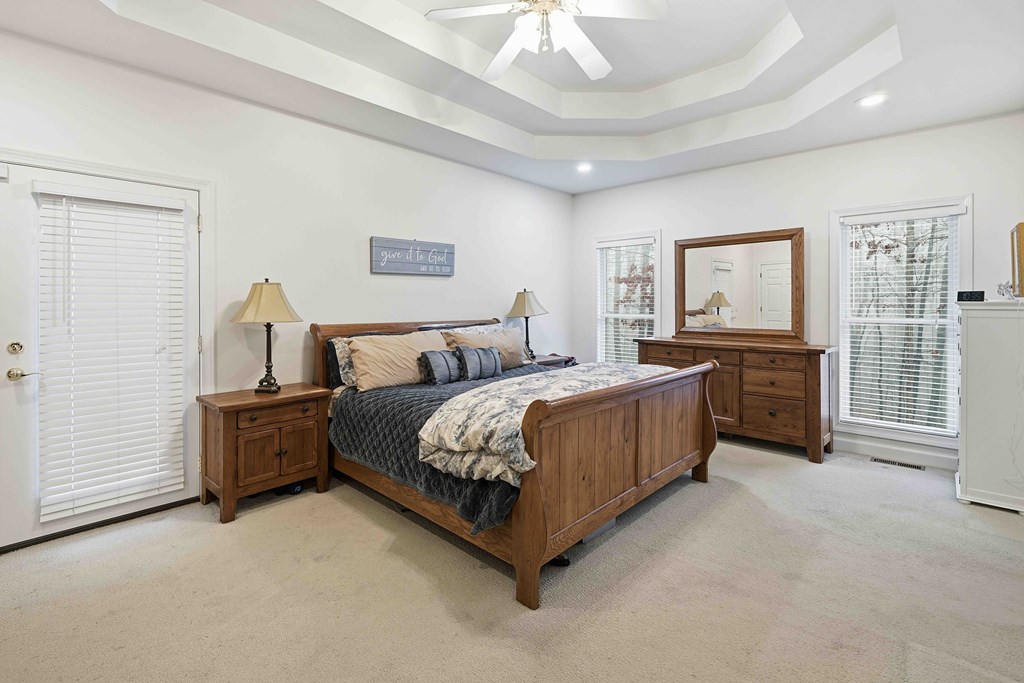 174 White Tail Ridge Road Jasper, GA 30143 - Photo 19 of 66 a spacious bedroom with a bed and cabinets