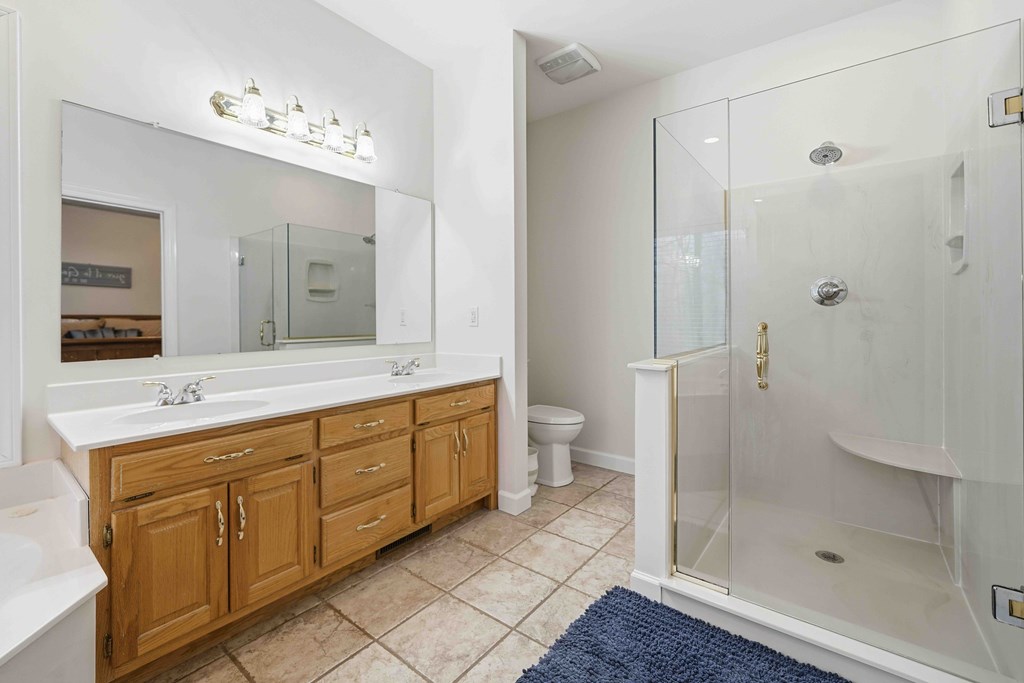 174 White Tail Ridge Road Jasper, GA 30143 - Photo 21 of 66 a spacious bathroom with a double vanity sink mirror and toilet