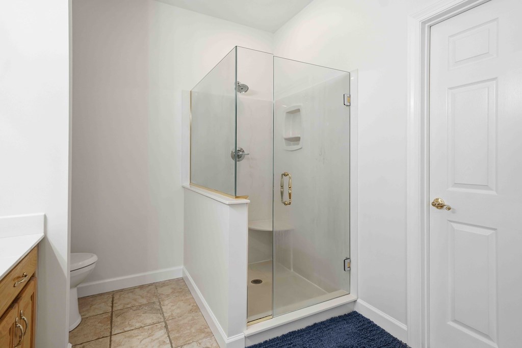 174 White Tail Ridge Road Jasper, GA 30143 - Photo 22 of 66 a bathroom with a shower and a toilet