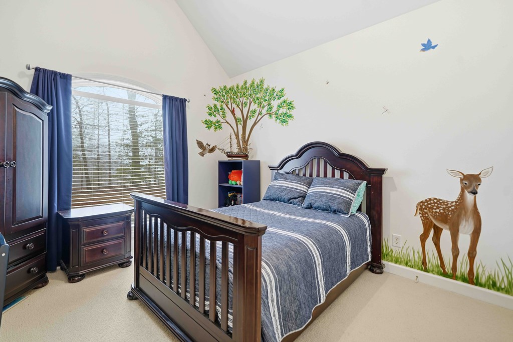 174 White Tail Ridge Road Jasper, GA 30143 - Photo 26 of 66 a bedroom with a bed and a tv in it