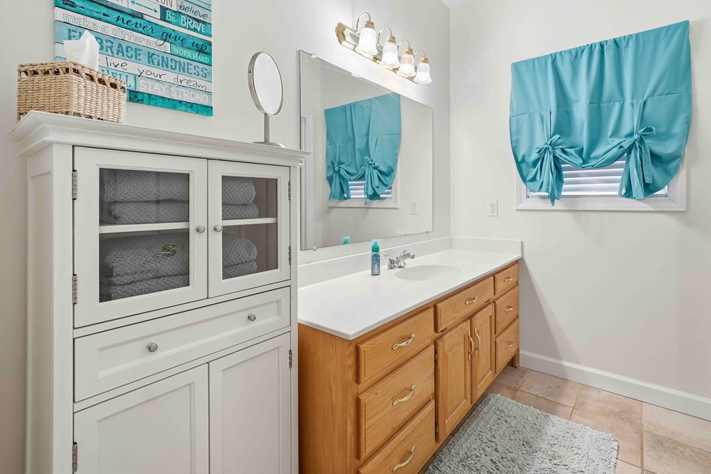 174 White Tail Ridge Road Jasper, GA 30143 - Photo 27 of 66 a bathroom with a sink and a mirror