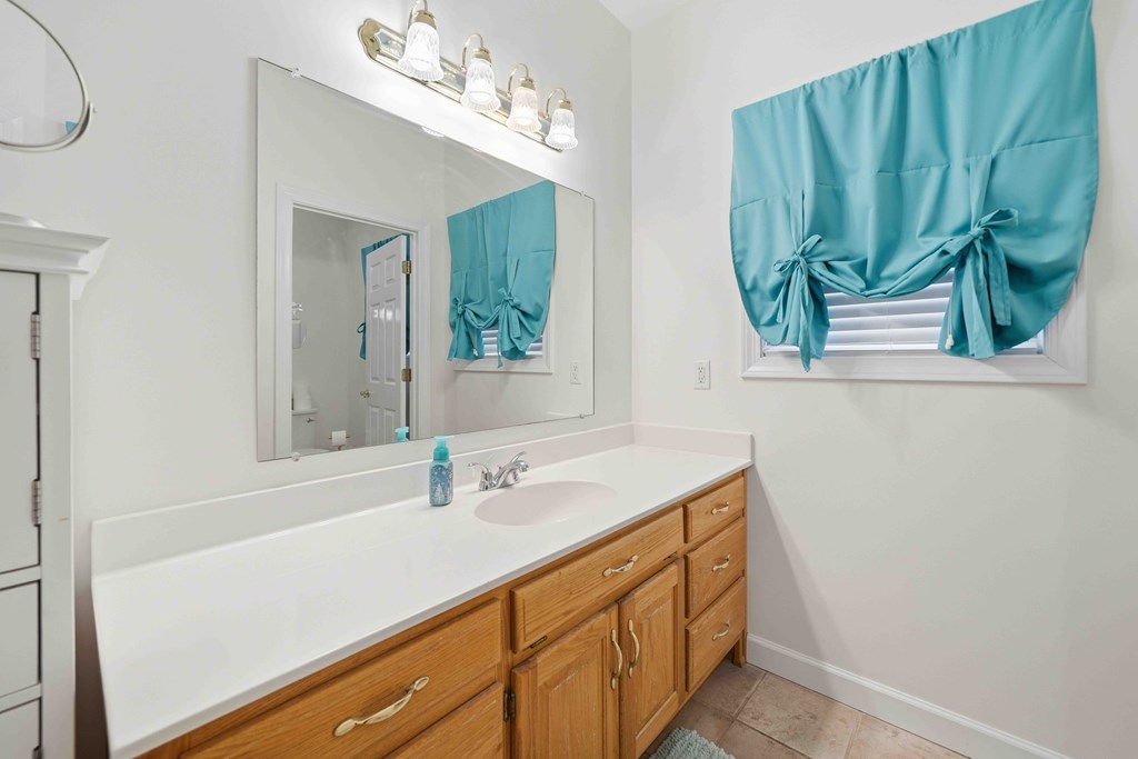 174 White Tail Ridge Road Jasper, GA 30143 - Photo 28 of 66 a bathroom with a sink and a mirror
