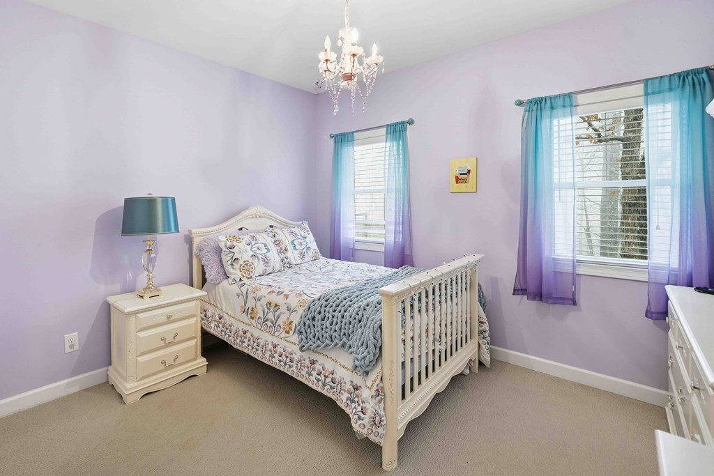 174 White Tail Ridge Road Jasper, GA 30143 - Photo 30 of 66 a bedroom with a bed chandelier and a window