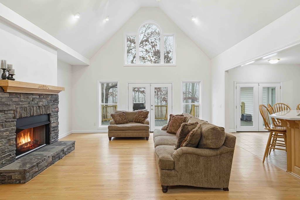 174 White Tail Ridge Road Jasper, GA 30143 - Photo 6 of 66 a living room with furniture and a fireplace