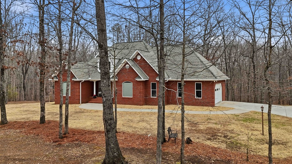174 White Tail Ridge Road Jasper, GA 30143 - Photo 65 of 66 a front view of a house with a yard covered in snow