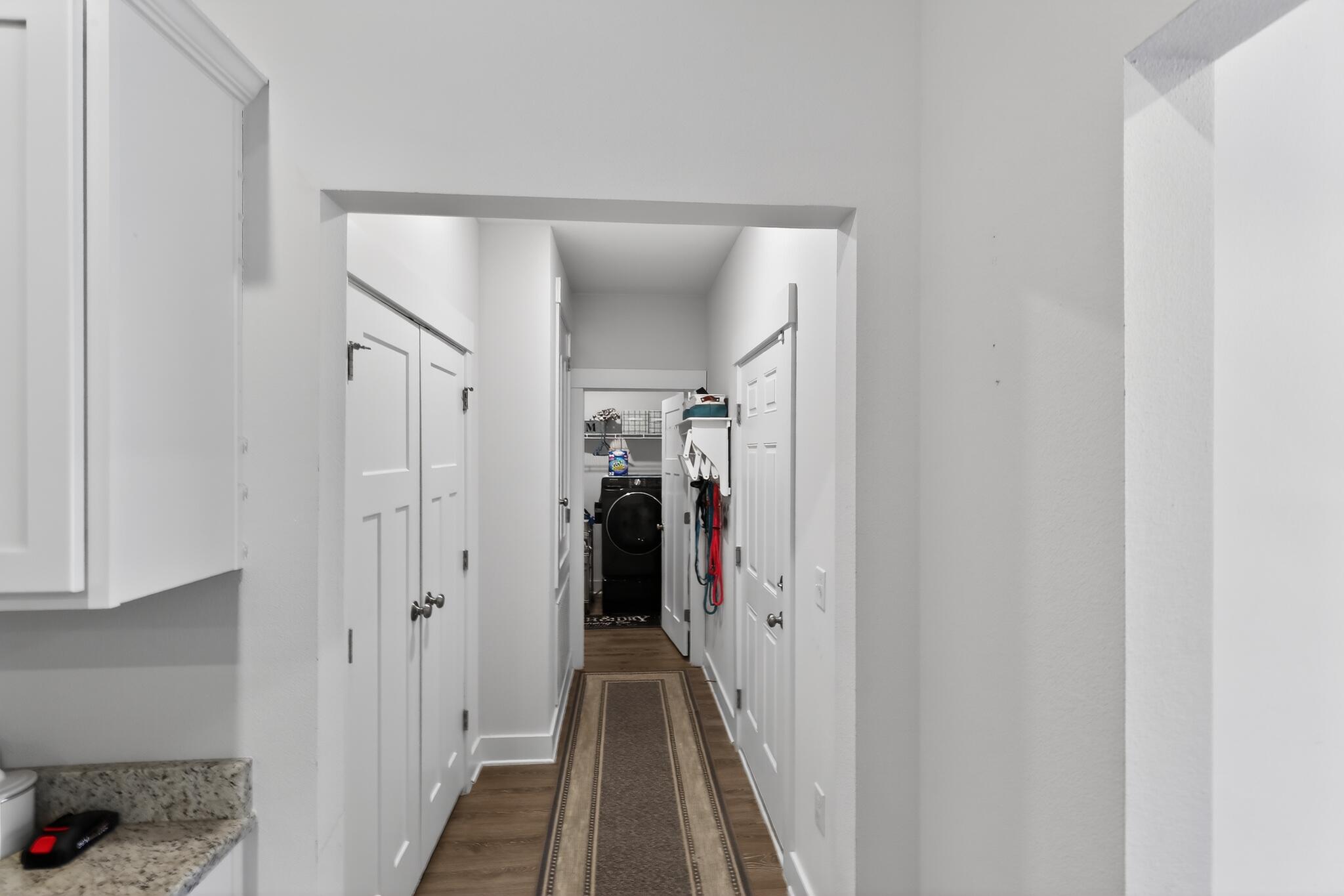 6070 Carina Road Crestview, FL 32539 - Photo 5 of 10 a view of a hallway with a hardwood floor