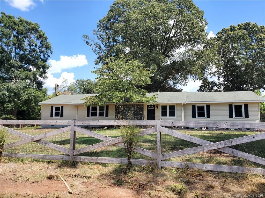 2415 Ruben Road Monroe, NC 28112 - Photo 1 of 42 a view of a house with a backyard