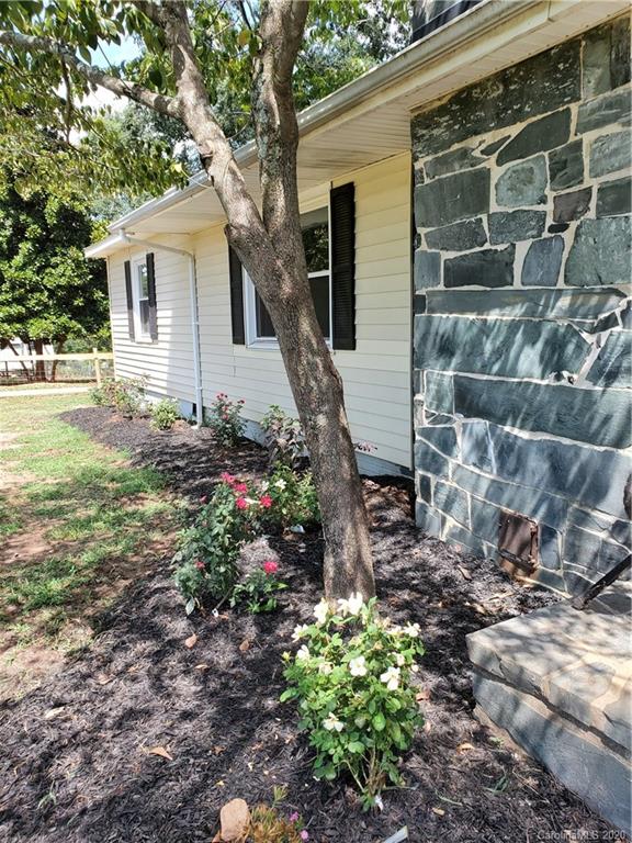 2415 Ruben Road Monroe, NC 28112 - Photo 14 of 42 a view of a house with a yard
