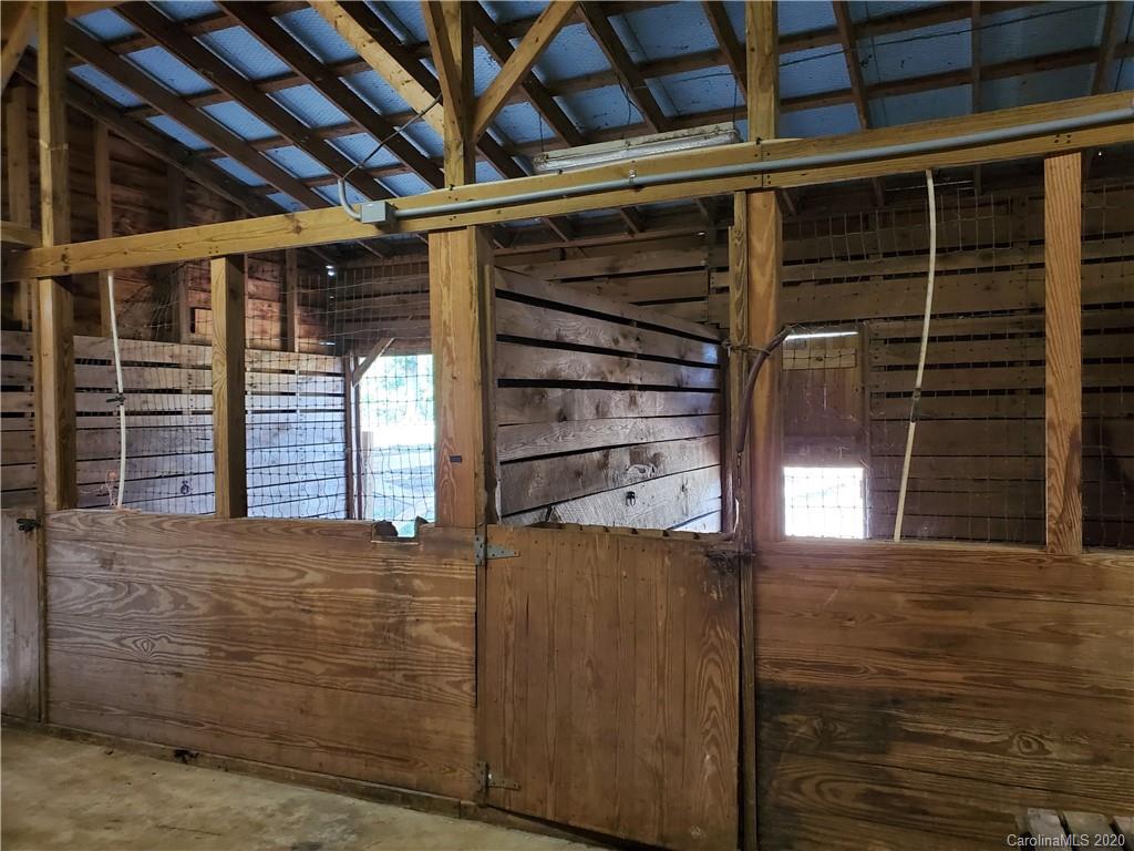 2415 Ruben Road Monroe, NC 28112 - Photo 22 of 42 a view of an empty room with wooden floor and windows