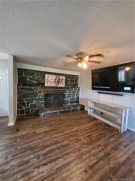 2415 Ruben Road Monroe, NC 28112 - Photo 27 of 42 a view of a livingroom with furniture and a flat screen tv