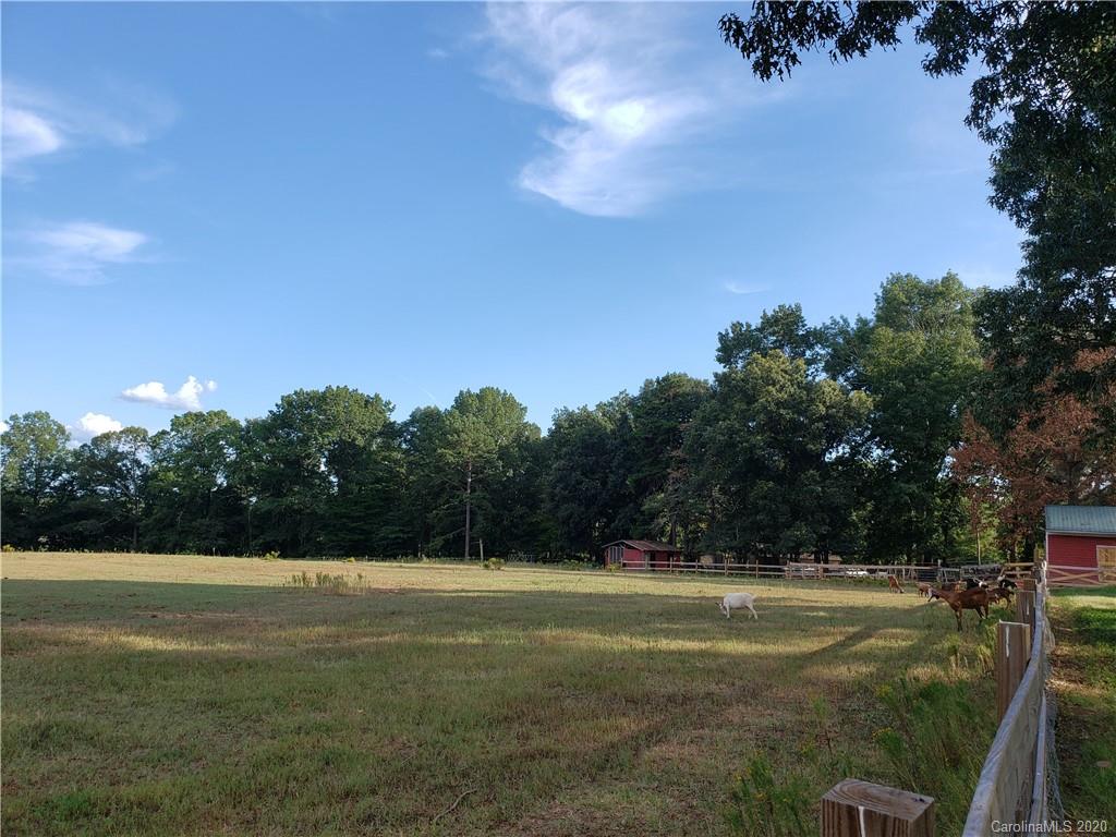2415 Ruben Road Monroe, NC 28112 - Photo 7 of 42 a view of a green field