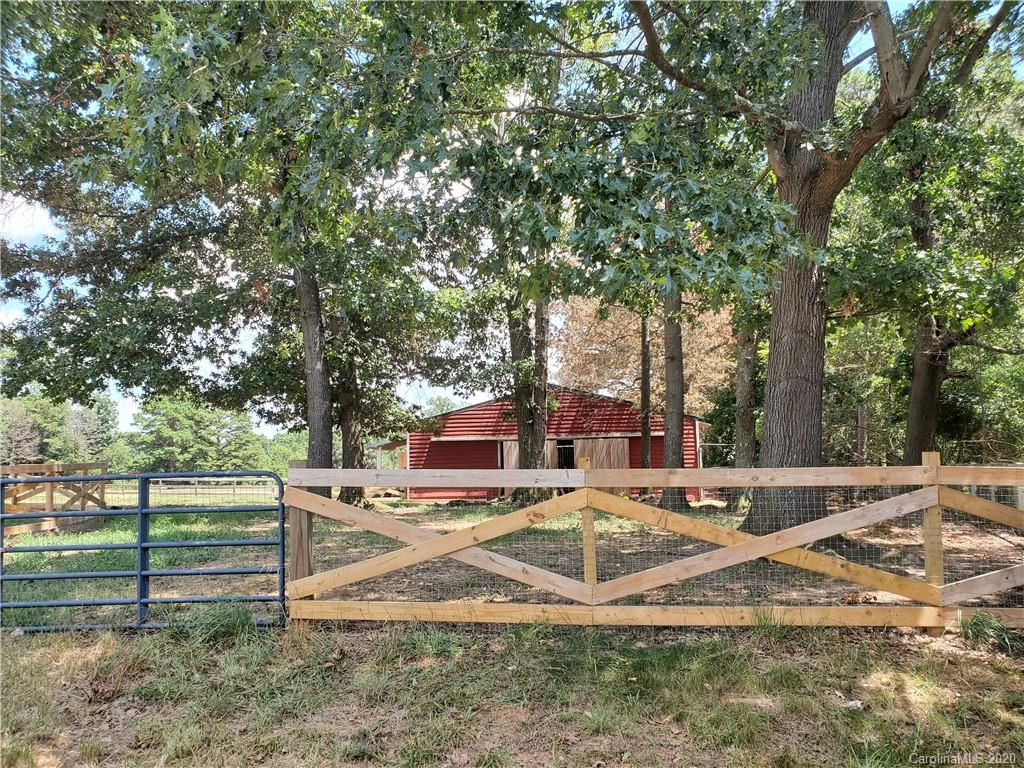 2415 Ruben Road Monroe, NC 28112 - Photo 9 of 42 a view of a house with backyard and trees