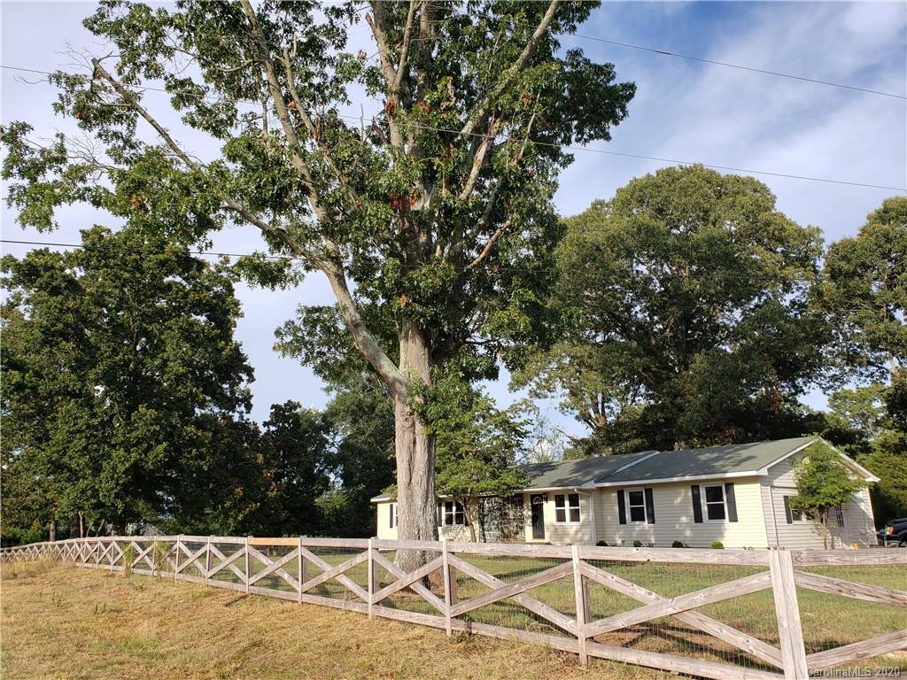 2415 Ruben Road Monroe, NC 28112 - Photo 10 of 42 a house with trees in the background