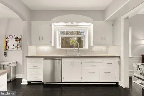 a kitchen with stainless steel appliances a stove and a refrigerator