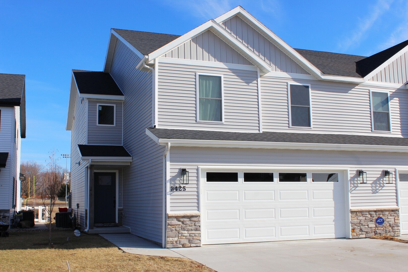 425 Jenny Lane, Unit B Heyworth, IL 61745 - Photo 1 of 25 a front view of a house with a yard