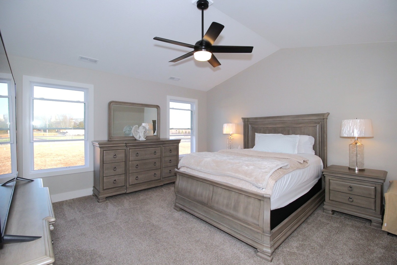 425 Jenny Lane, Unit B Heyworth, IL 61745 - Photo 13 of 25 a bedroom with a bed and a dresser