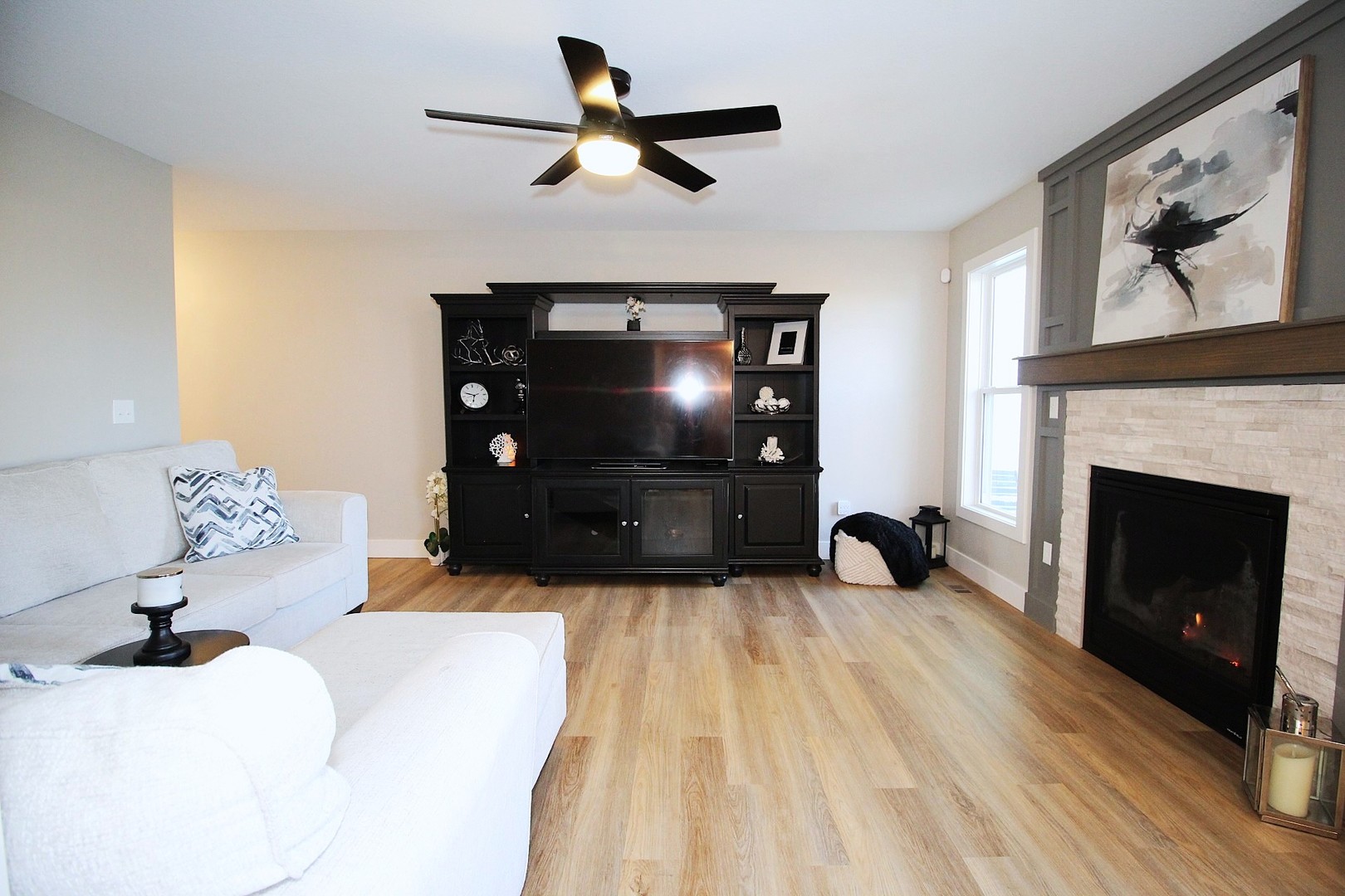 425 Jenny Lane, Unit B Heyworth, IL 61745 - Photo 8 of 25 a living room with furniture and a fireplace