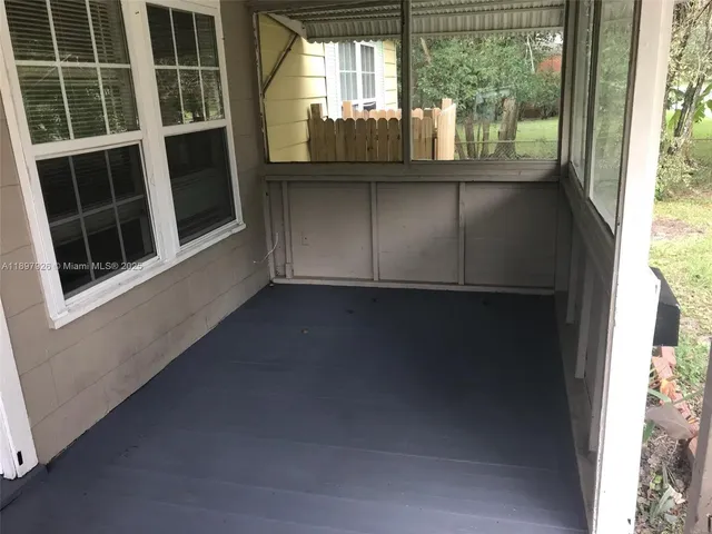 a view of empty room with windows