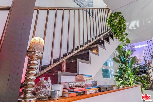 a lobby with furniture and a potted plant