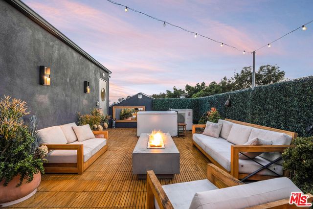 a outdoor living space with furniture and city view