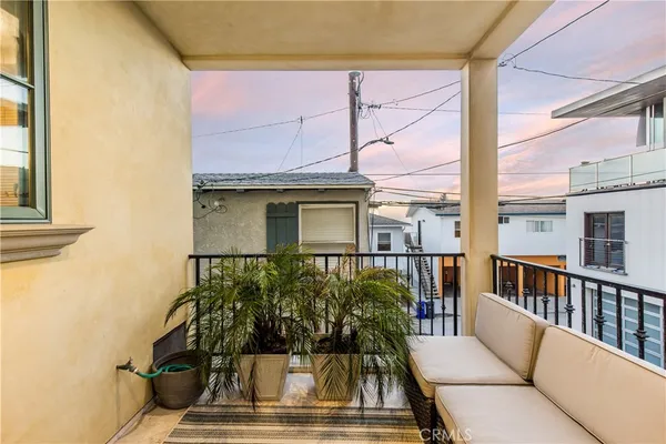 a view of a balcony with chairs