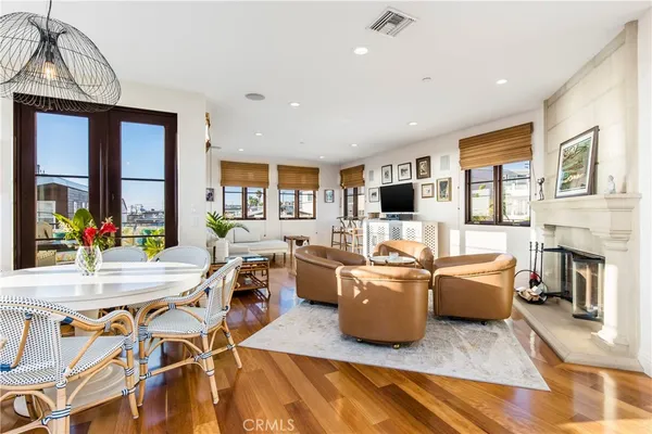a living room with furniture flat screen tv and a fireplace