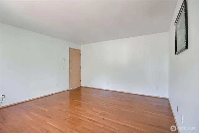 a bathroom with a granite countertop sink mirror and a bathtub
