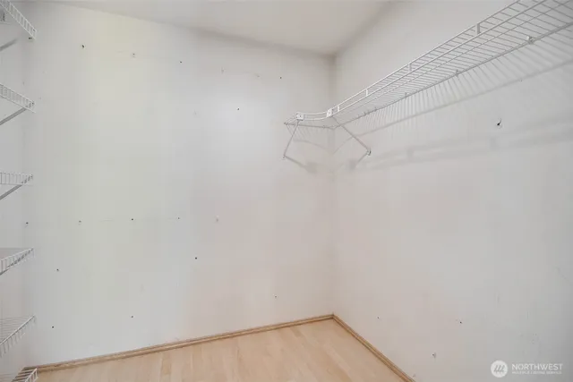 a view of empty room with ceiling fan