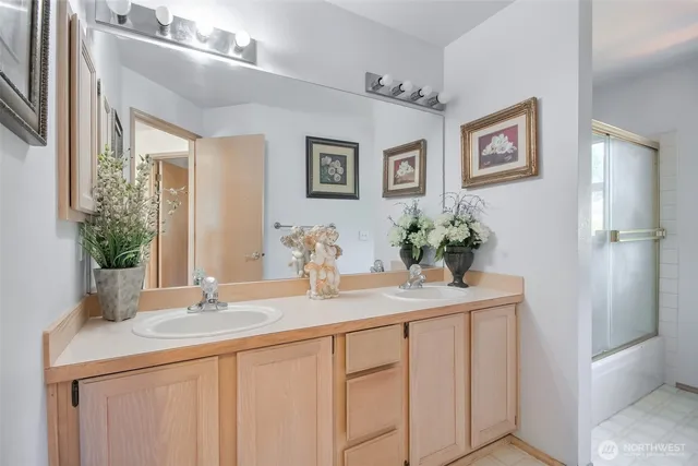 a bathroom with a sink a washer and dryer