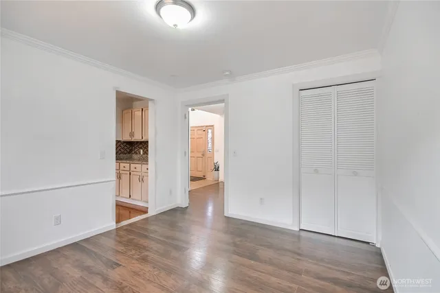 wooden floor with white walls