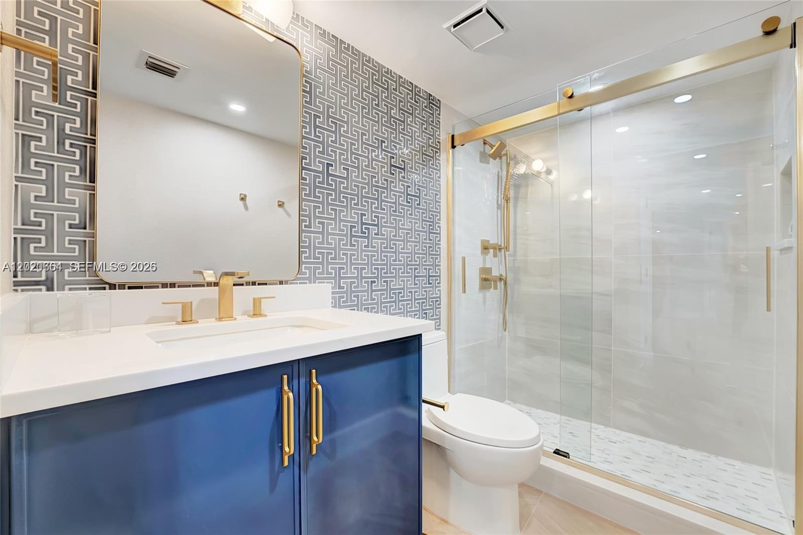 300 Ocean Trail Way, Unit 702 Jupiter, FL 33477 - Photo 18 of 31 a bathroom with a sink a toilet and shower