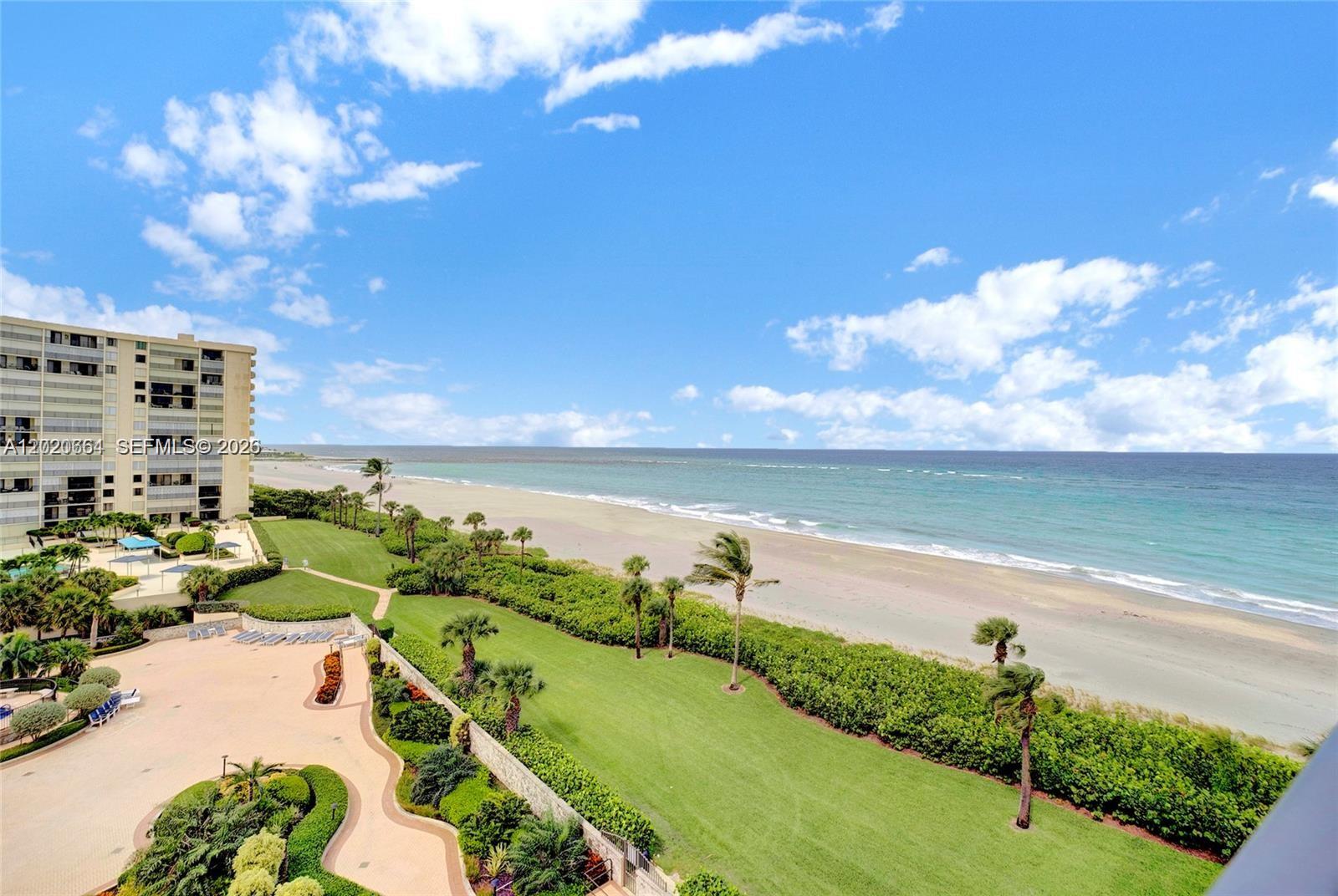 300 Ocean Trail Way, Unit 702 Jupiter, FL 33477 - Photo 21 of 31 a view of a lake with a yard