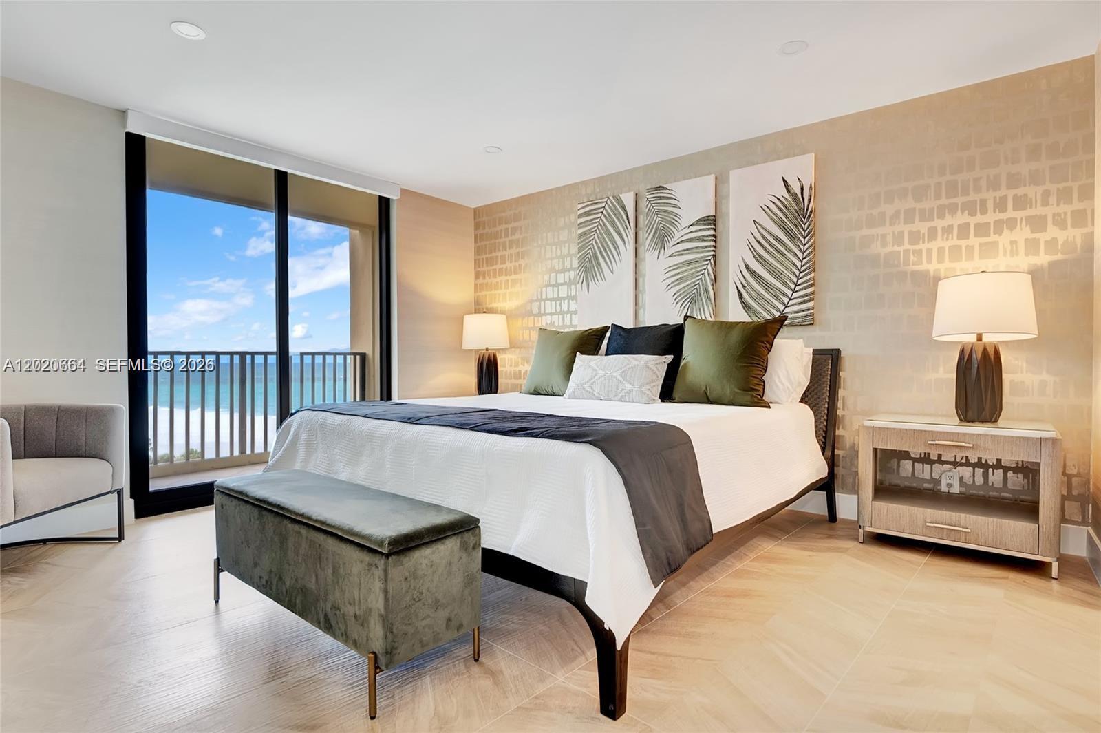 300 Ocean Trail Way, Unit 702 Jupiter, FL 33477 - Photo 8 of 31 a bedroom with a bed and wooden floor