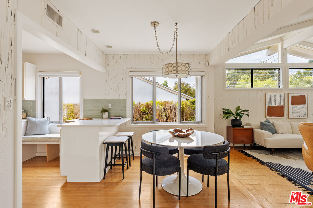 10749 Molony Road Culver City, CA 90230 - Photo 8 of 19 a view of a dining room with furniture window and wooden floor
