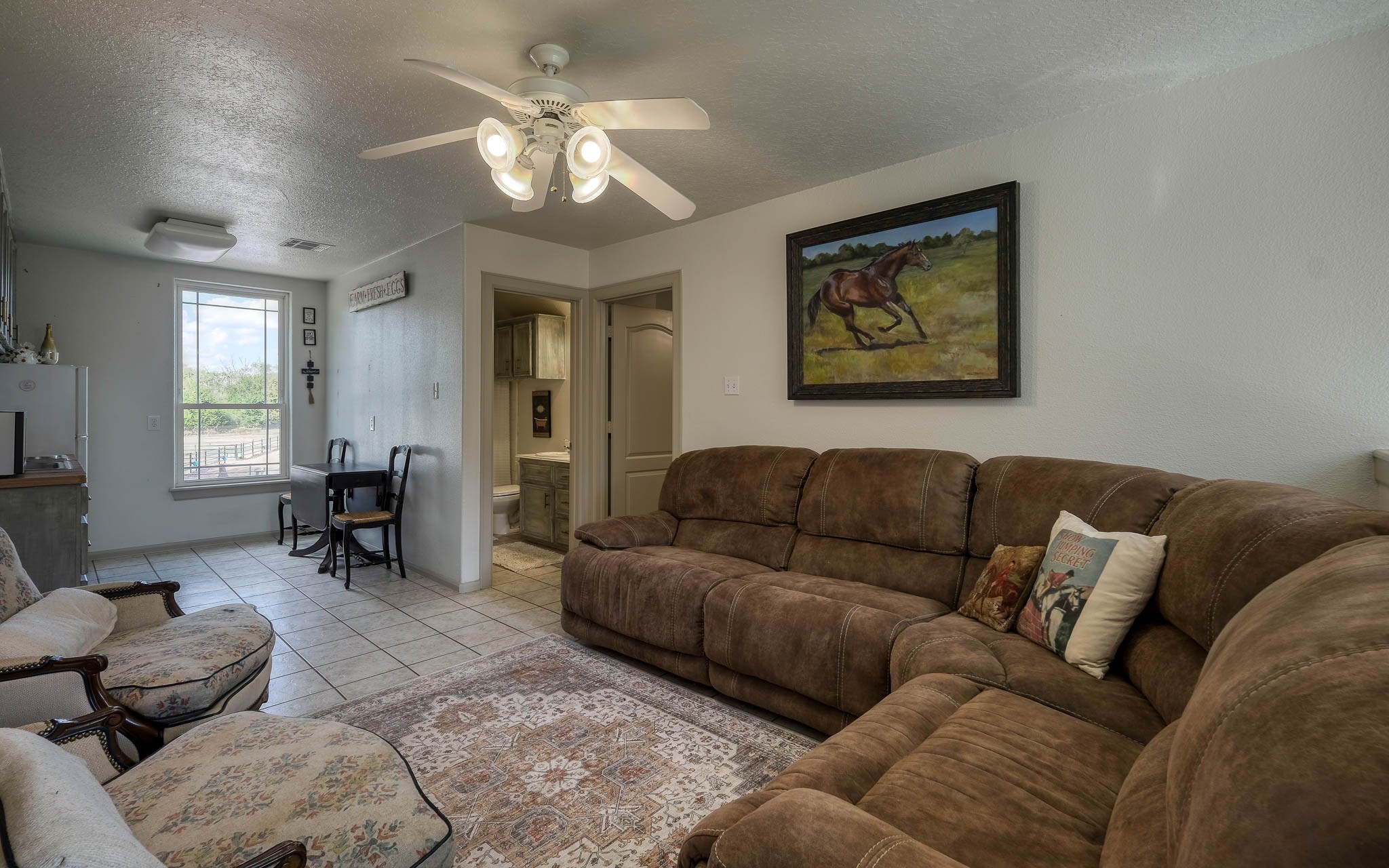 22474 Kmiec Road Hempstead, TX 77445 - Photo 40 of 49 a living room with furniture and a chandelier