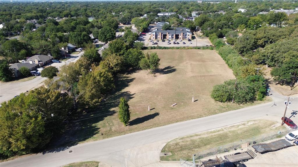 801 Singleton Boulevard Irving, TX 75060 - Photo 11 of 12 an aerial view of a house with a yard and garden