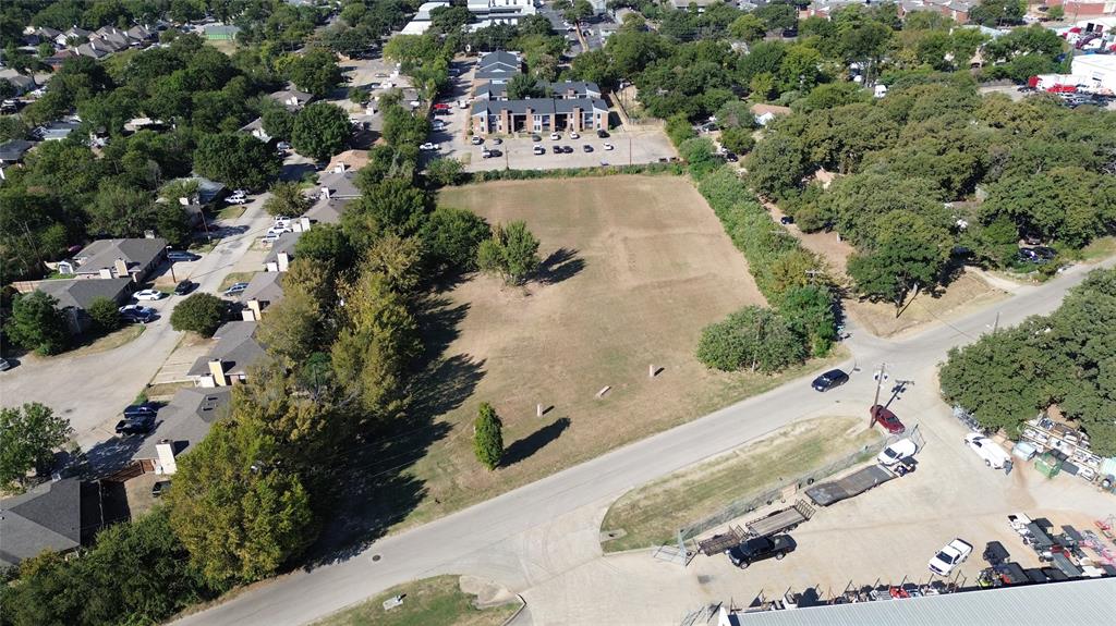 801 Singleton Boulevard Irving, TX 75060 - Photo 4 of 12 an aerial view of a house with a yard and large trees