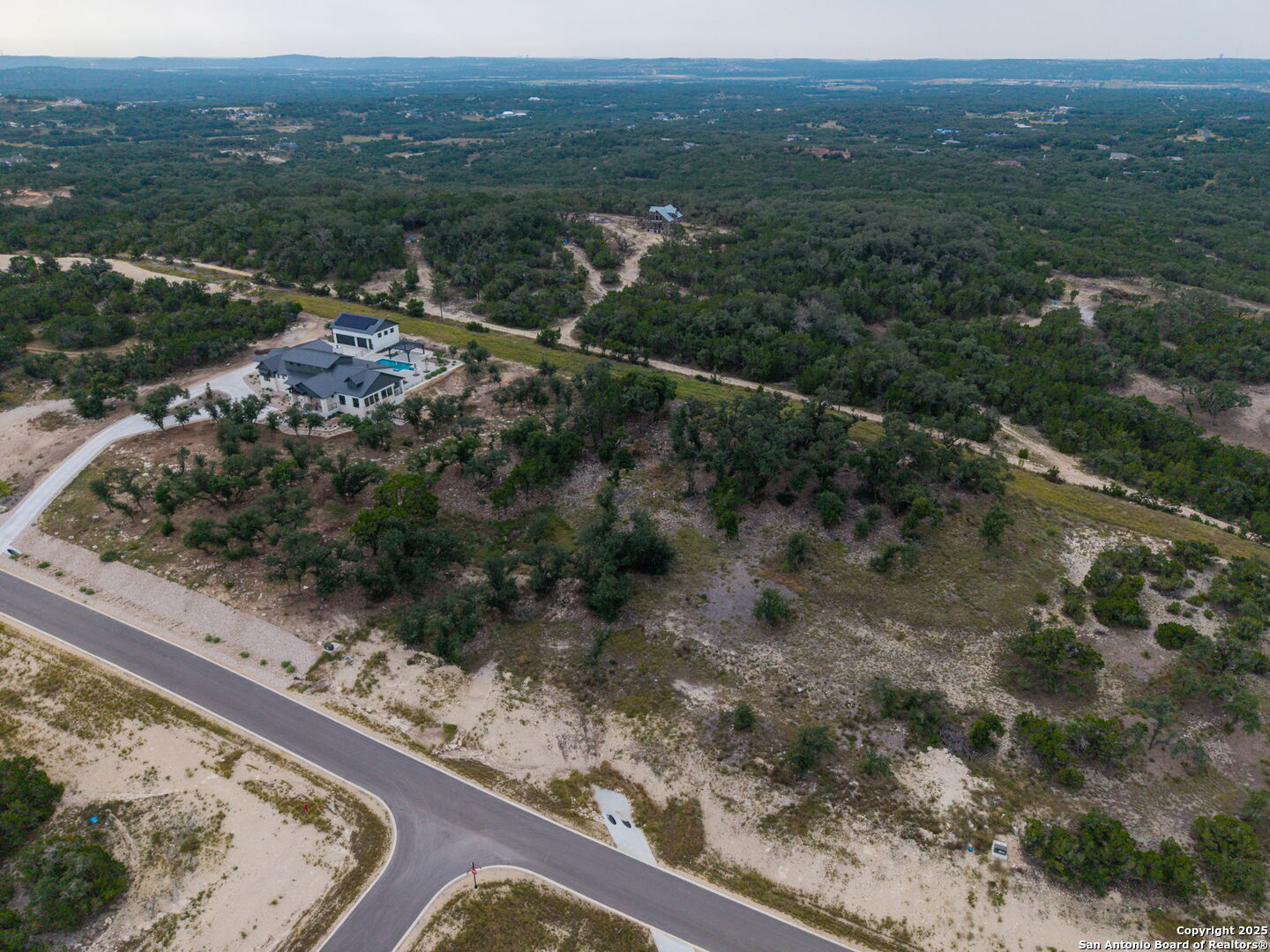 593 Rosemary Rdg Drive Bulverde, TX 78163 - Photo 9 of 18 a view of a forest with mountains in the background